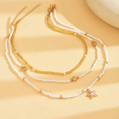 Collier Coquillage et Étoile