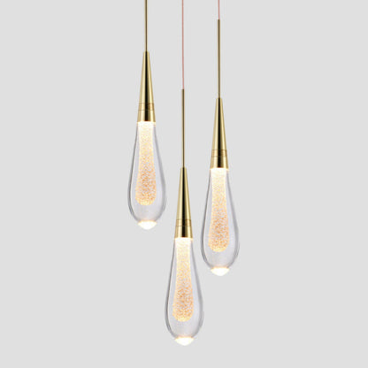 Elegante lámpara colgante dorada en forma de gota – Lujo para cualquier espacio