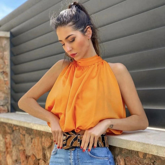 Elegantes oranges Oberteil mit dezentem Glanz und femininer Passform
