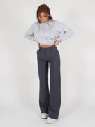 Pantalon élégant taille haute avec couture verticale à l’avant