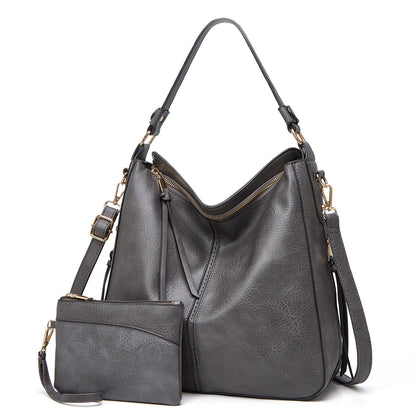 Classic leather shoulder bag with sleek gold details