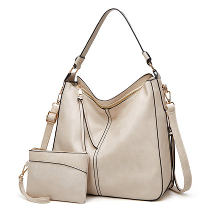 Classic leather shoulder bag with sleek gold details