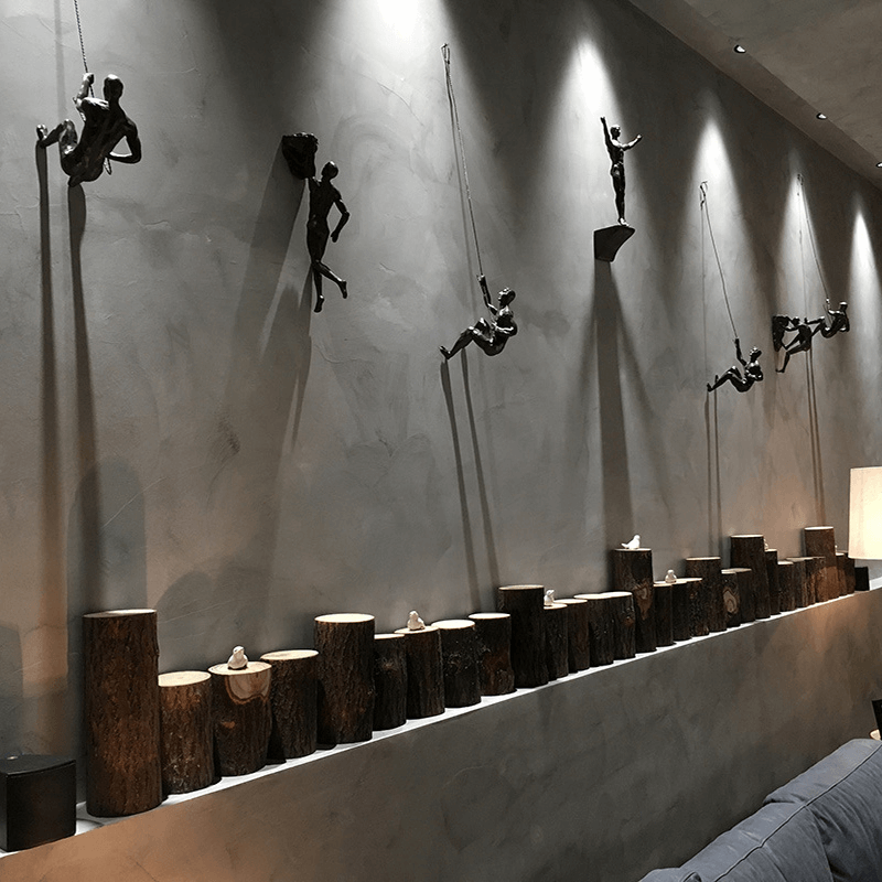 Conjunto de esculturas decorativas de pared con figuras trepadoras para una decoración moderna