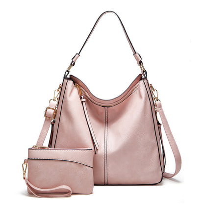 Classic leather shoulder bag with sleek gold details