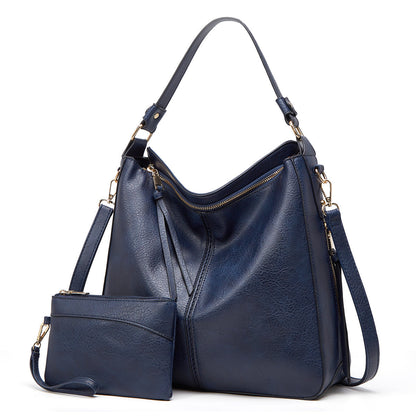 Classic leather shoulder bag with sleek gold details