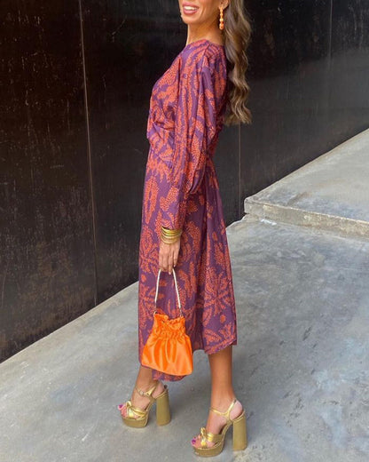 Printed midi dress with button closure at the front and deep V-neck