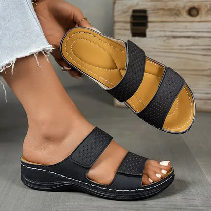 Flat sandals with perforated straps