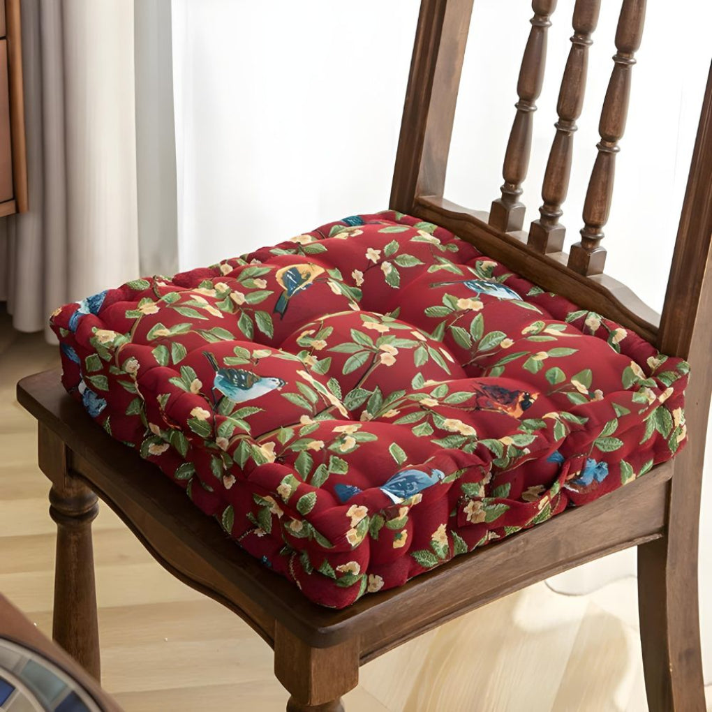Thick, padded seat cushion with straps for dining or patio chairs