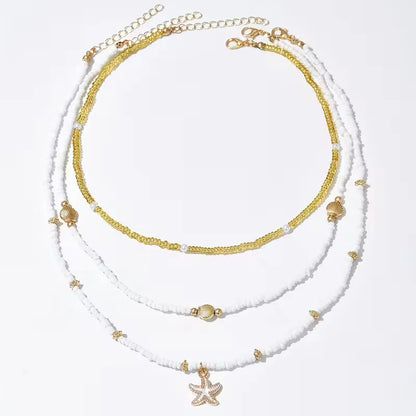 Collier Coquillage et Étoile