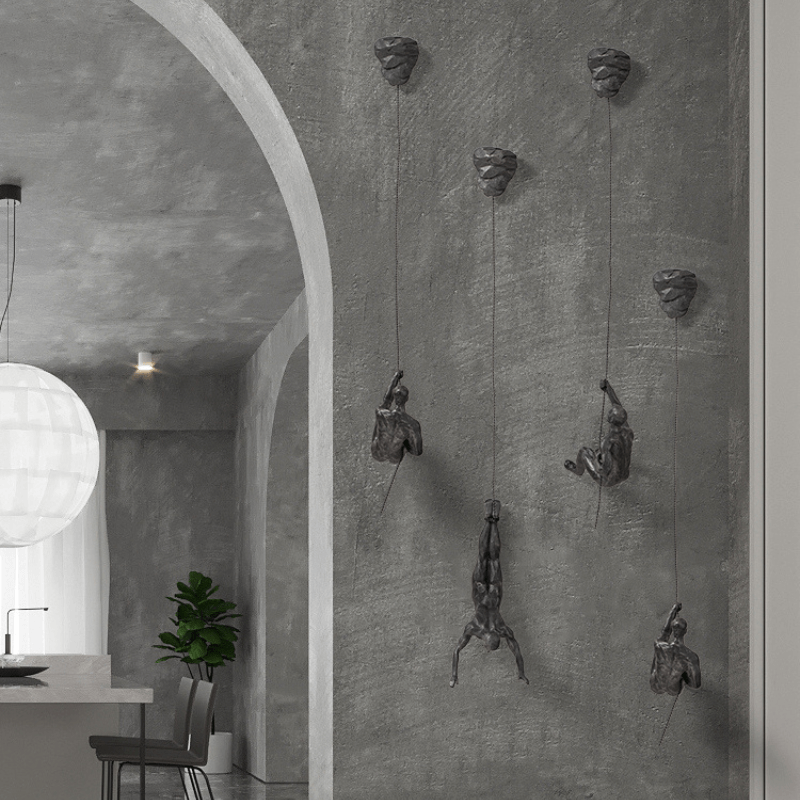Conjunto de esculturas decorativas de pared con figuras trepadoras para una decoración moderna