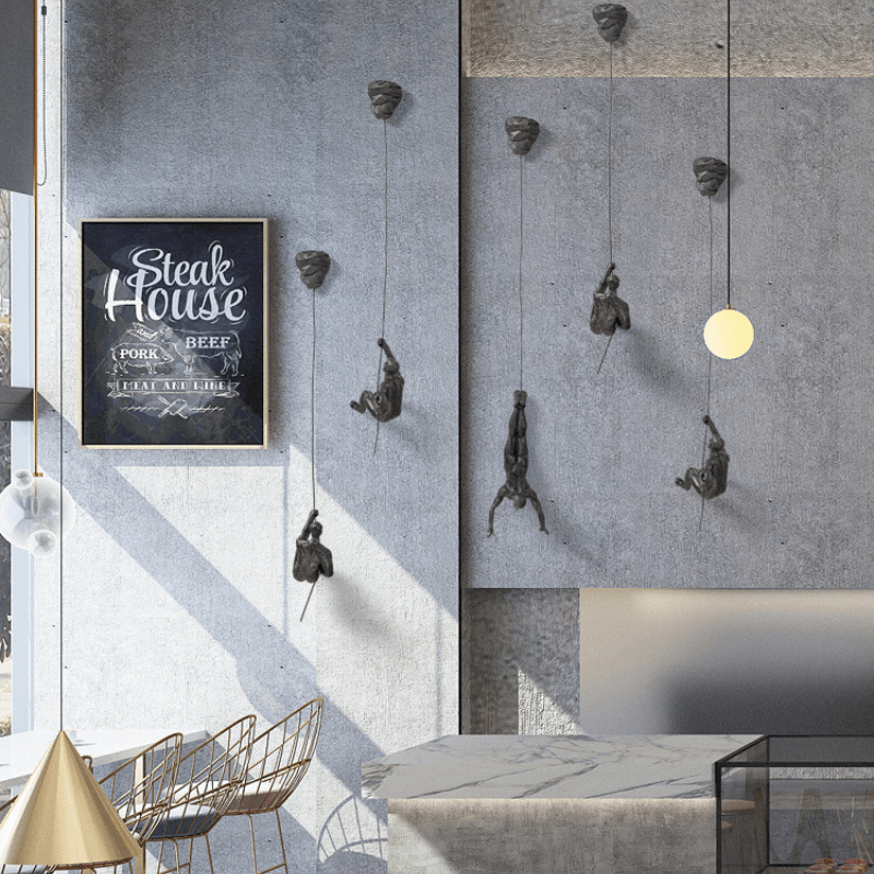 Conjunto de esculturas decorativas de pared con figuras trepadoras para una decoración moderna