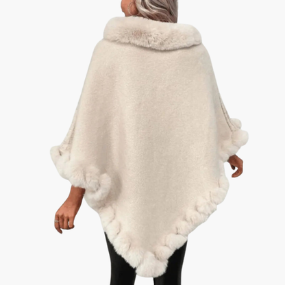 Poncho da donna in maglia con bordo in pelliccia sintetica e vestibilità oversize