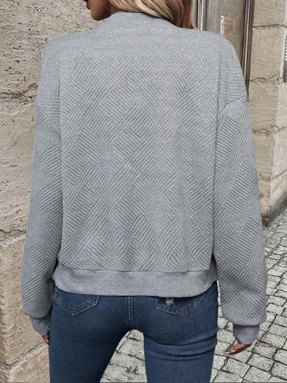 Bomber jacket with geometric pattern and round neck