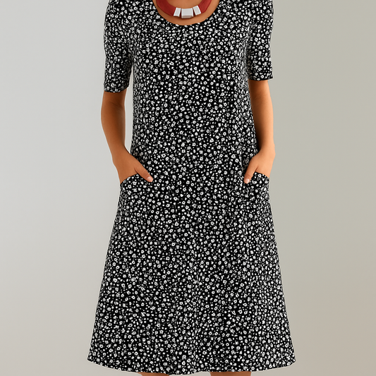 Vestido midi floral con cintura alta y bolsillos