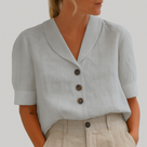 Blusa elegante y atemporal para mujer, con cuello de solapa y cierre de botones