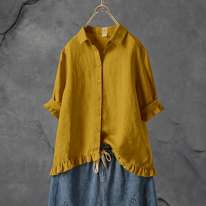 Cotton blouse with buttons and pleated hem