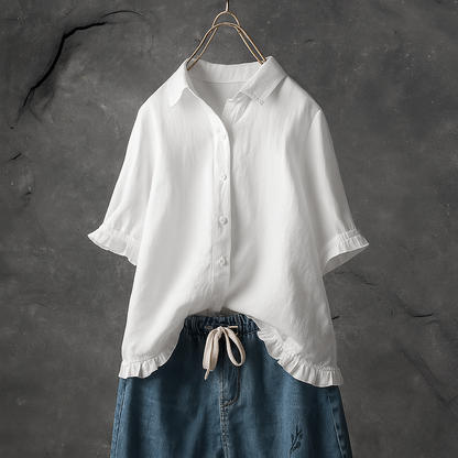 Cotton blouse with buttons and pleated hem