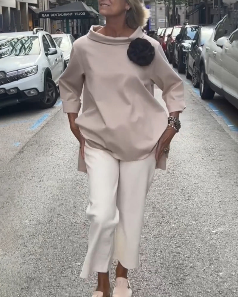 Elegant blouse with an irregular cut and long sleeves