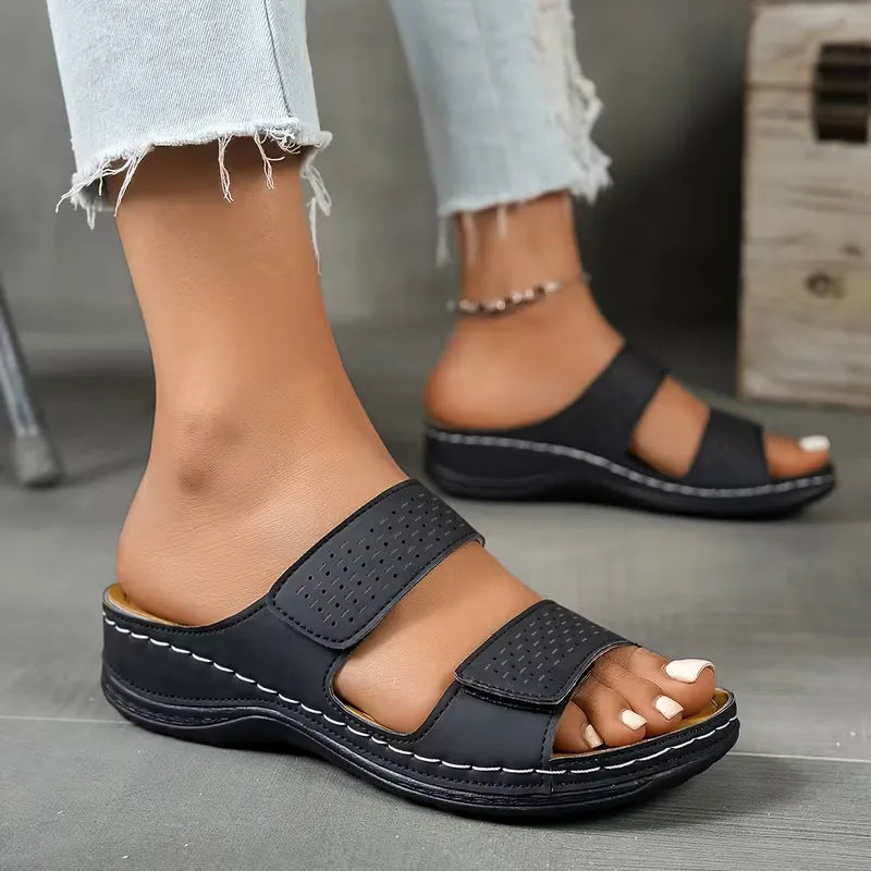 Flat sandals with perforated straps