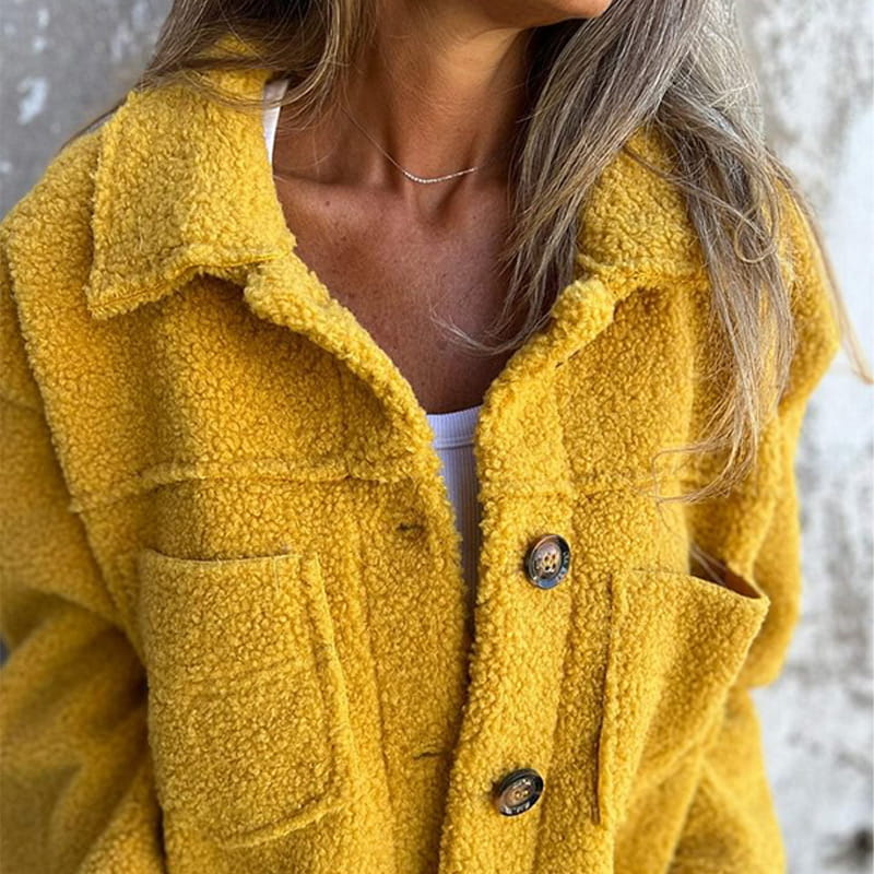 Fluffy coat with classic collar and patch pockets