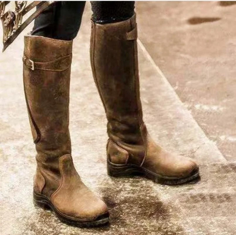 High model boots with buckle closure