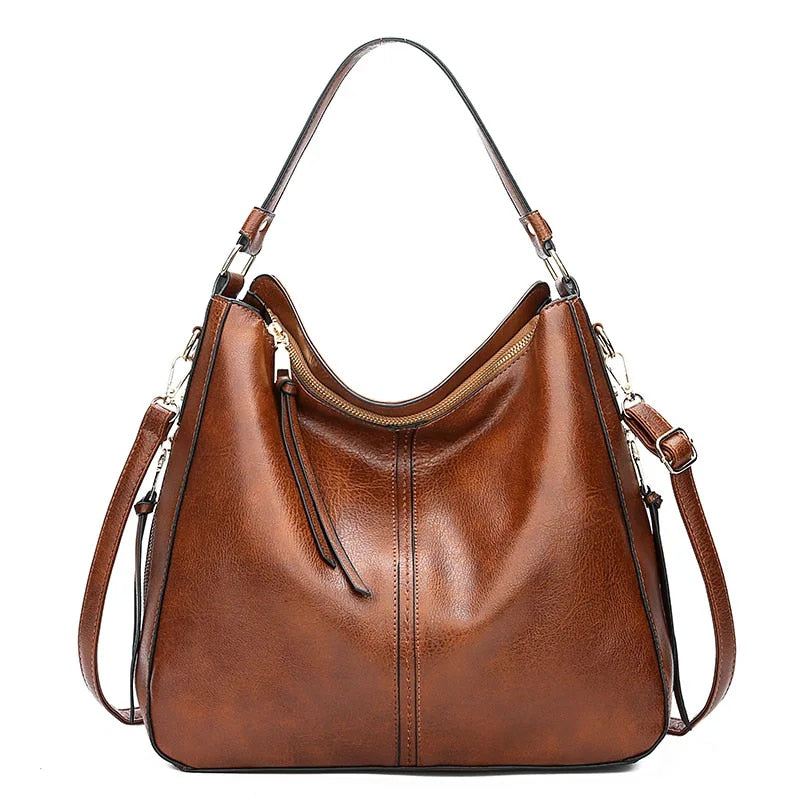 Classic leather shoulder bag with sleek gold details
