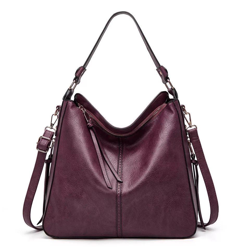 Classic leather shoulder bag with sleek gold details
