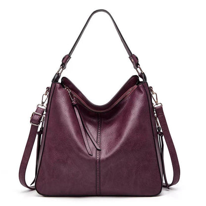 Classic leather shoulder bag with sleek gold details