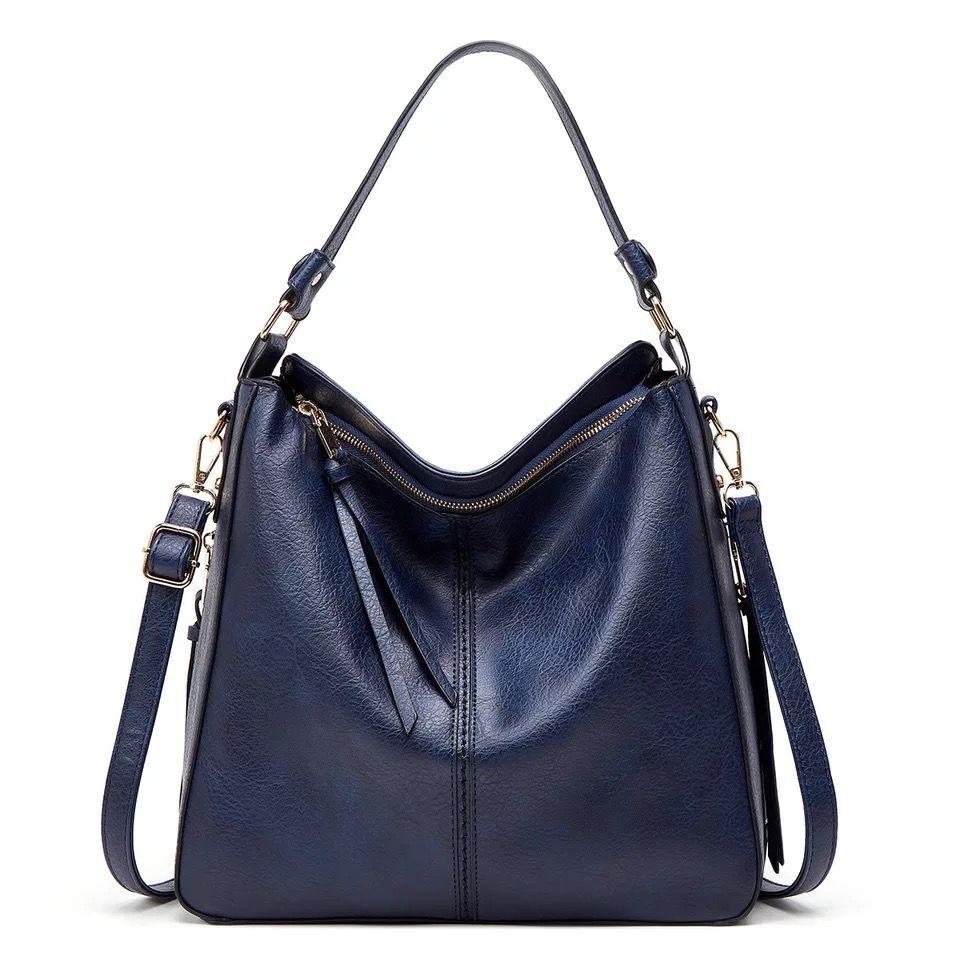 Classic leather shoulder bag with sleek gold details