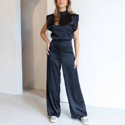 Sleeveless jumpsuit with luxurious satin look and wide legs
