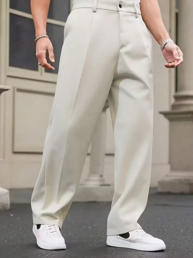 Straight trousers with pleated details and side pockets