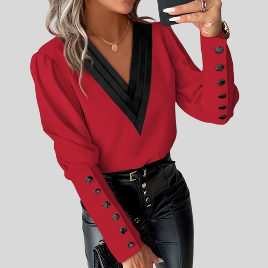 Blusa de mujer con botones y mangas abullonadas