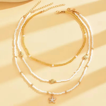 Collier Coquillage et Étoile
