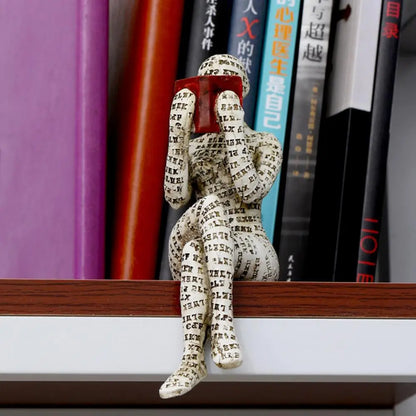 Dekorative Figur mit Lesemotiv als inspirierende und stilvolle Innendekoration