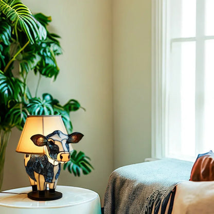Lámpara de mesa con diseño Tiffany y forma de vaca, luz cálida y estilo artístico para un interior acogedor