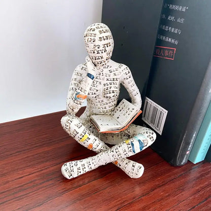 Dekorative Figur mit Lesemotiv als inspirierende und stilvolle Innendekoration