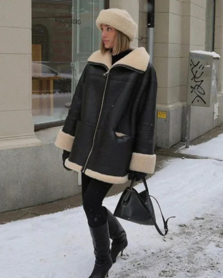 Abrigo de invierno negro de cuero, corte extragrande y forro de borreguito para mujer